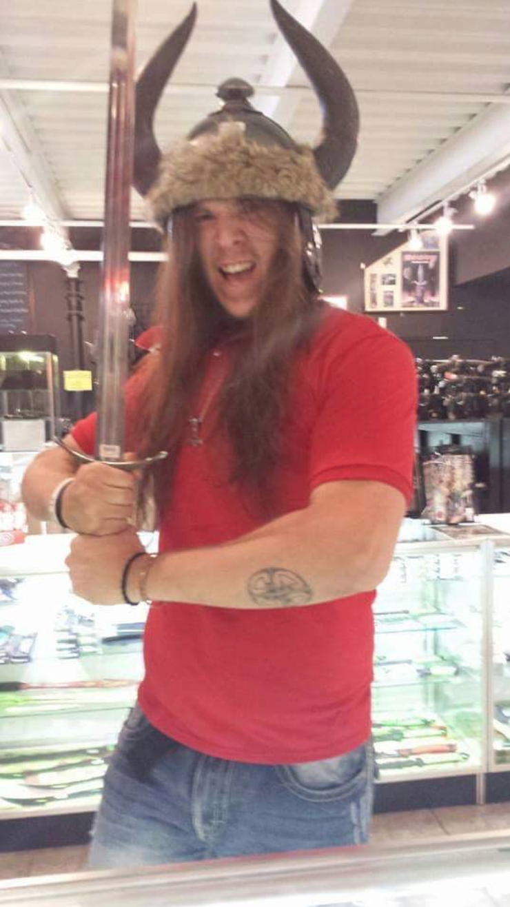 Jacob Scott Goodwin holds a sword.