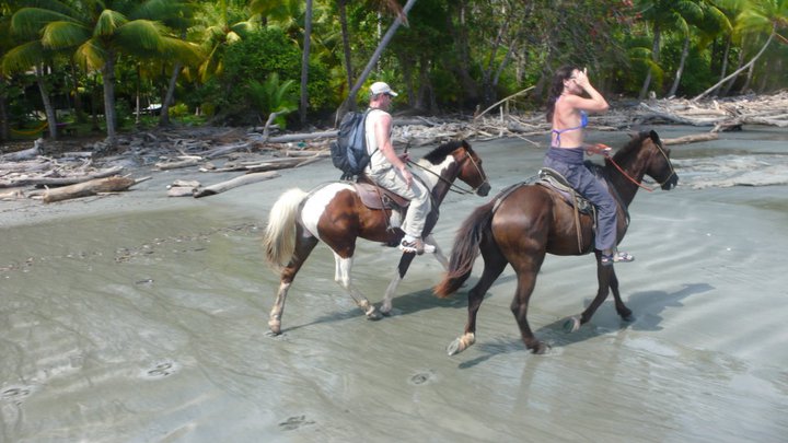 Sara Carter and Marty riding horses in Costa Rica​