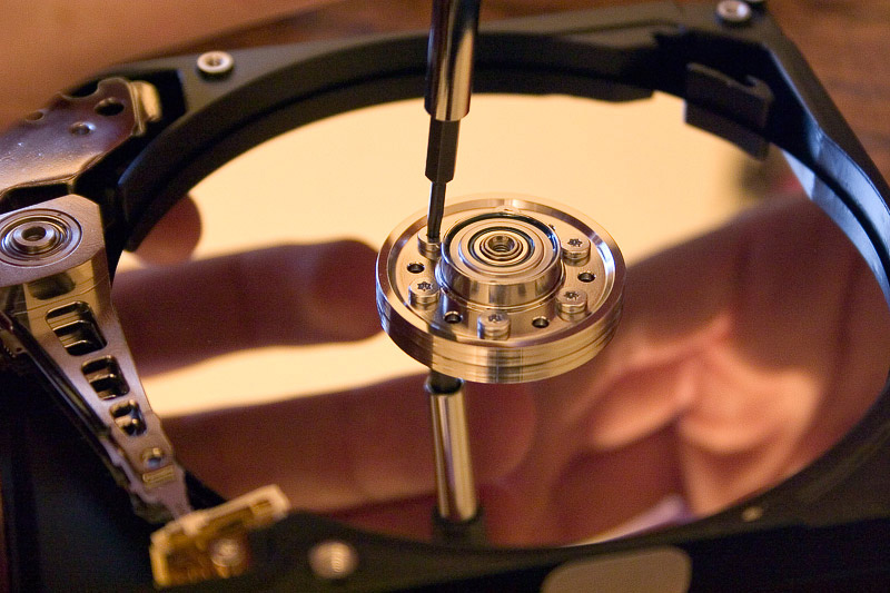 A hard disk drive with protective cover removed.