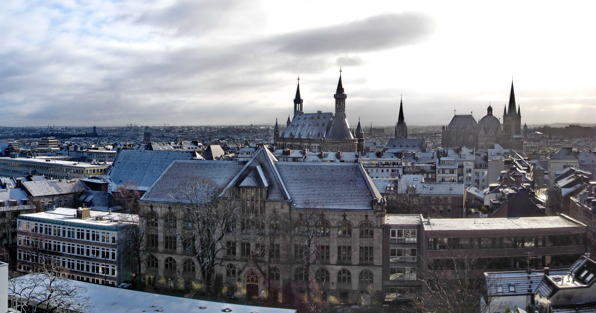 Panoramic view of Aachen, including Kaiser-Karls-Gymnasium (foreground), <a href="/content/Aachen_Rathaus" style="color:blue">city hall</a> (back centre) and <a href="/content/Aachen_Cathedral" style="color:blue">cathedral</a> (back right)
