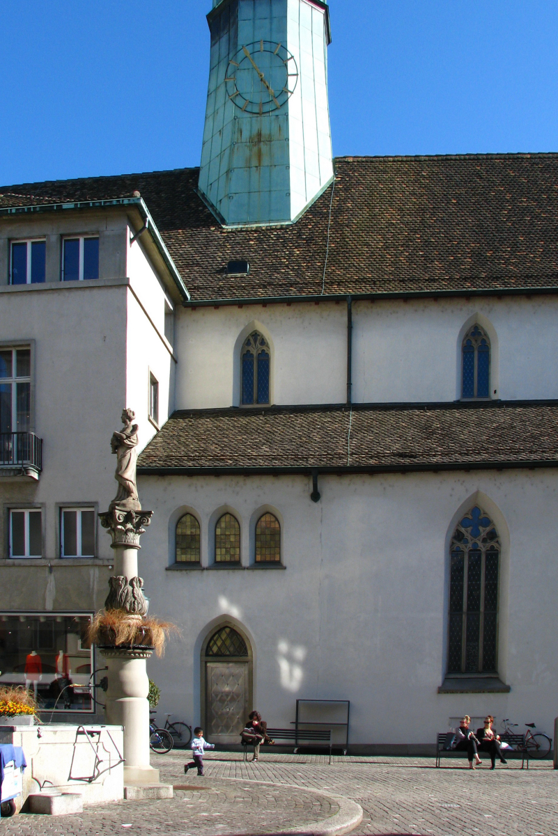 Augustinerkirche at <i><a href="/content/M%C3%BCnzplatz" style="color:blue">Münzplatz</a></i> in Zürich as seen from <a href="/content/Augustinergasse" style="color:blue">Augustinergasse</a>