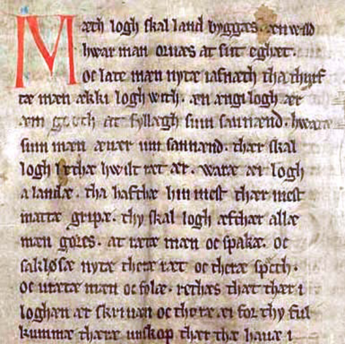 The first page of the Jutlandic Law originally from 1241 in <a href="/content/Codex_Holmiensis" style="color:blue">Codex Holmiensis</a>, copied in 1350. <b>The first sentence is:</b> "<i>Mæth logh skal land byggas</i>" <b>Modern orthography:</b> "Med lov skal land bygges" <b>English translation:</b> "With law shall a country be built"