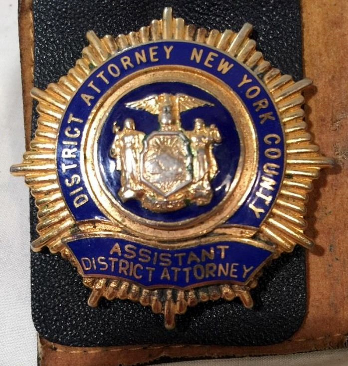Shield of an Assistant District Attorney (ADA)