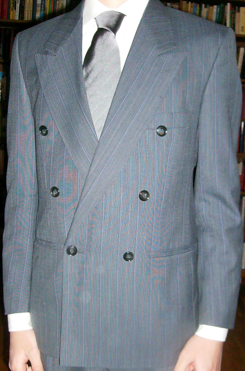A grey striped six-on-one double-breasted suit with jetted pockets, a style popular in the 1980s