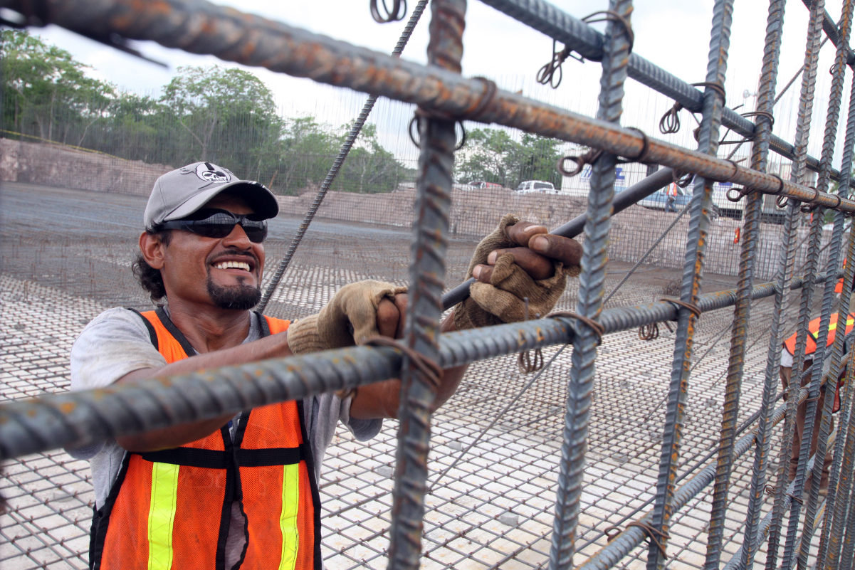 Worker assembling <a href="/content/Rebar" style="color:blue">rebar</a> for a water treatment plant in <a href="/content/Mazatlan" style="color:blue">Mazatlan</a>, <a href="/content/Sinaloa" style="color:blue">Sinaloa</a>, <a href="/content/Mexico" style="color:blue">Mexico</a>.