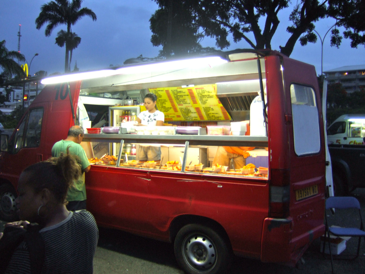 A food truck in <a href="/content/Noum%C3%A9a" style="color:blue">Nouméa</a>, New Caledonia, serving <a href="/content/Chinese_food" style="color:blue">Chinese food</a>, 2011