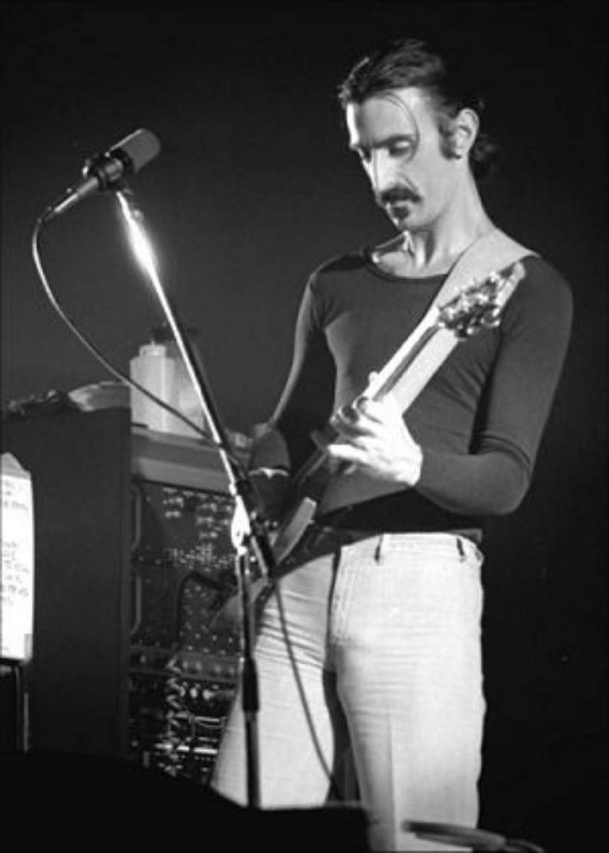 Zappa performing live at <a href="/content/Ekeberghallen" style="color:blue">Ekeberghallen</a> in <a href="/content/Oslo" style="color:blue">Oslo</a>, Norway, 1977