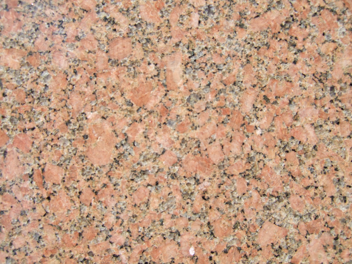 Granite containing <a href="/content/Potassium_feldspar" style="color:blue">potassium feldspar</a>, <a href="/content/Plagioclase_feldspar" style="color:blue">plagioclase feldspar</a>, <a href="/content/Quartz" style="color:blue">quartz</a>, and <a href="/content/Biotite" style="color:blue">biotite</a> and/or <a href="/content/Amphibole" style="color:blue">amphibole</a>