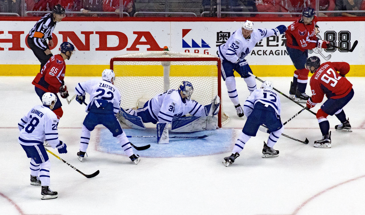 The <a href="/content/Toronto_Maple_Leafs" style="color:blue">Toronto Maple Leafs</a> (white) defend their goal against the <a href="/content/Washington_Capitals" style="color:blue">Washington Capitals</a> (red) during Round 1 of the <a href="/content/2017_Stanley_Cup_playoffs" style="color:blue">2017 Stanley Cup playoffs</a>.