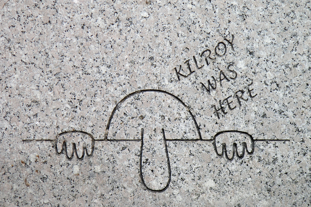Engraving of Kilroy on the <a href="/content/National_World_War_II_Memorial" style="color:blue">WWII Memorial</a> in <a href="/content/Washington_DC" style="color:blue">Washington DC</a>
