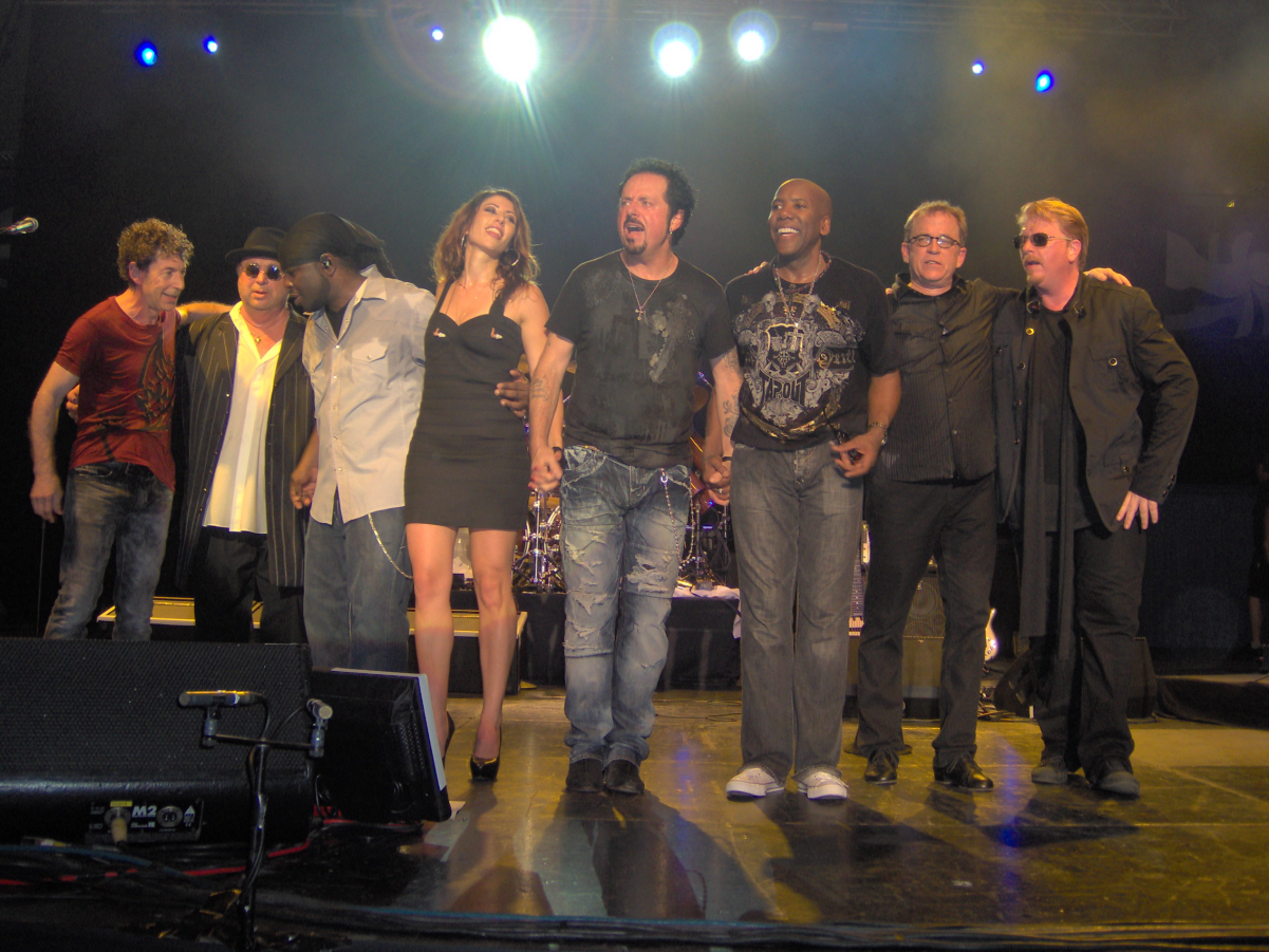 Toto live in <a href="/content/Copenhagen" style="color:blue">Copenhagen</a>, Denmark, at K.B. Hallen July 20, 2010. 2010 lineup, left to right, <a href="/content/Simon_Phillips_(drummer)" style="color:blue">Simon Phillips</a>, <a href="/content/David_Paich" style="color:blue">David Paich</a>, Mabvuto Carpenter, Jory Steinberg, <a href="/content/Steve_Lukather" style="color:blue">Steve Lukather</a>, <a href="/content/Nathan_East" style="color:blue">Nathan East</a>, <a href="/content/Steve_Porcaro" style="color:blue">Steve Porcaro</a>, <a href="/content/Joseph_Williams_(musician)" style="color:blue">Joseph Williams</a>