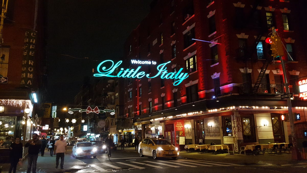Illuminated sign above <a href="/content/Mulberry_Street_(Manhattan)" style="color:blue">Mulberry Street</a> at <a href="/content/Broome_Street" style="color:blue">Broome Street</a>