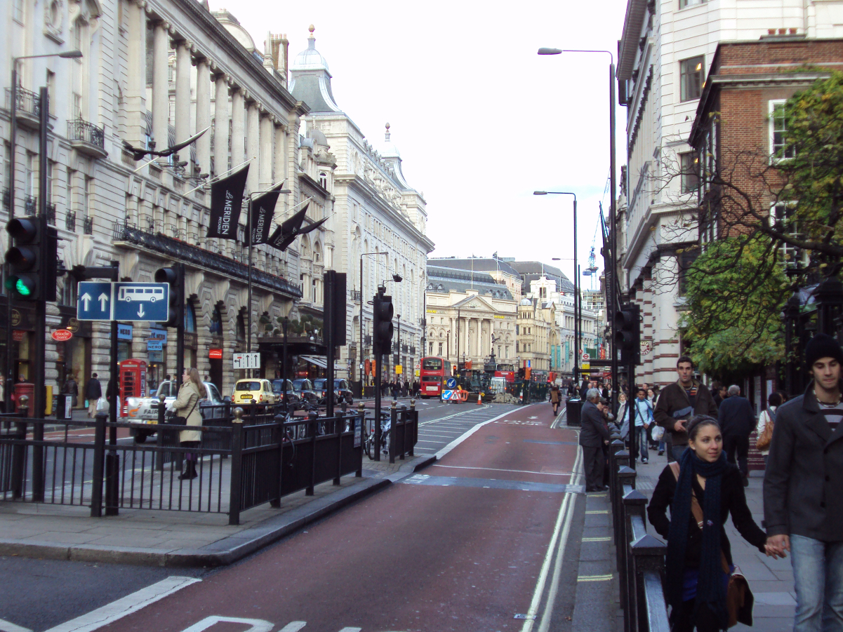 View of Piccadilly and <a href="/content/Le_M%C3%A9ridien_Piccadilly_Hotel" style="color:blue">Le Méridien Hotel</a>, looking towards <a href="/content/Piccadilly_Circus" style="color:blue">Piccadilly Circus</a>