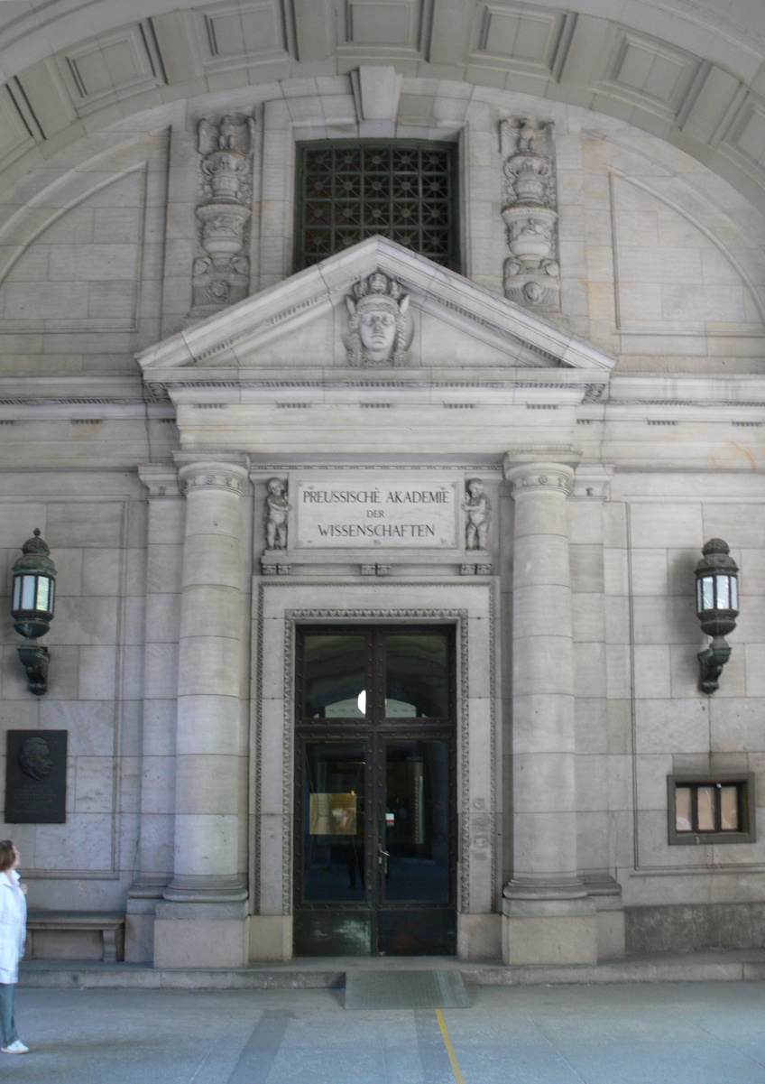 Entrance to the former <b>Prussian Academy of Sciences</b> on <a href="/content/Unter_Den_Linden" style="color:blue">Unter Den Linden</a> 8. Today it houses the <a href="/content/Berlin_State_Library" style="color:blue">Berlin State Library</a>.