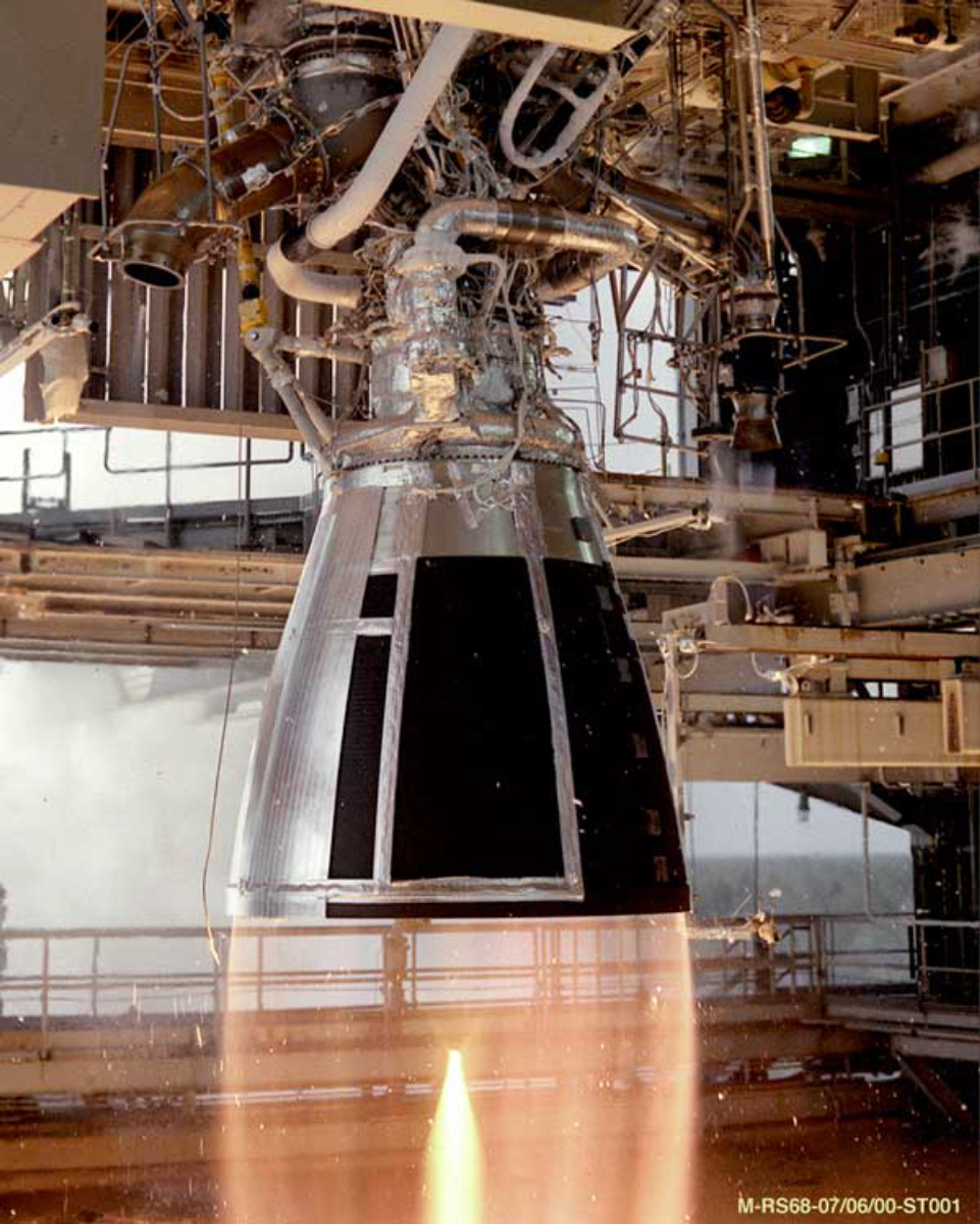 <a href="/content/RS-68" style="color:blue">RS-68</a> being tested at NASA's <a href="/content/Stennis_Space_Center" style="color:blue">Stennis Space Center</a>. The nearly transparent exhaust is due to this engine's exhaust being mostly <a href="/content/Superheated_steam" style="color:blue">superheated steam</a> (water vapour from its propellants, hydrogen and oxygen), plus some unburned hydrogen.
