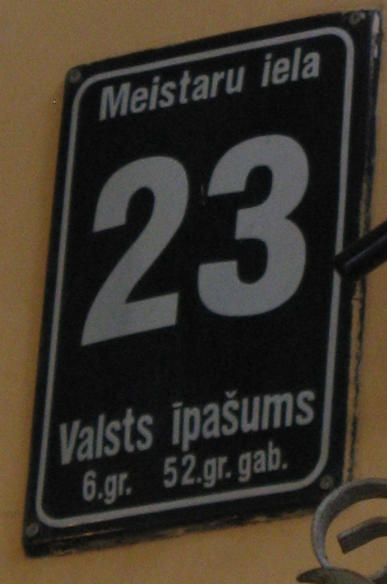 A plaque marking state property in <a href="/content/Riga" style="color:blue">Riga</a>, <a href="/content/Latvia" style="color:blue">Latvia</a>.